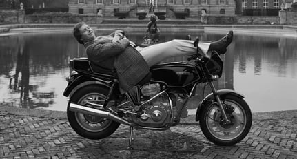 Lord Hesketh relaxing outside his Hawksmoor-designed estate